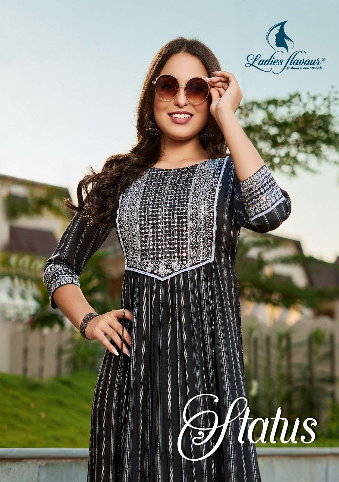 LADIES FLAVOUR STATUS NEW HEAVY FANCY DESIGNER RAYON WEAVING STRIP EMBRODIERY WORK NYRA CUT KURTI FESTIVAL COLLECTION WHOLESALER